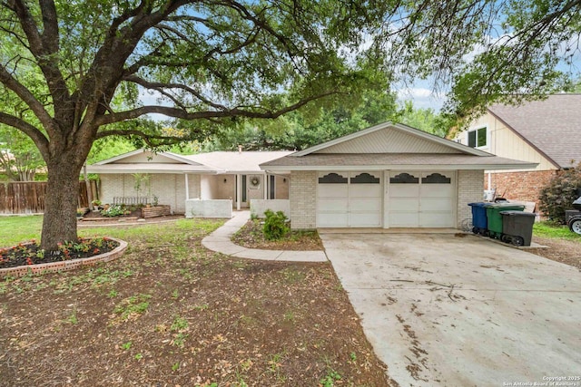 10514 Merritime Ct, San Antonio, TX 78217 - ranch-style home with a garage, brick siding, driveway, and fence