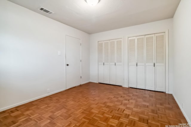 10514 Merritime Ct, San Antonio, TX 78217 - unfurnished bedroom featuring baseboards and multiple closets