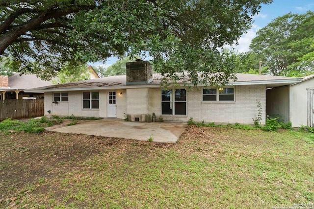 10514 Merritime Ct, San Antonio, TX 78217 - back of property featuring brick siding, a patio, and a chimney