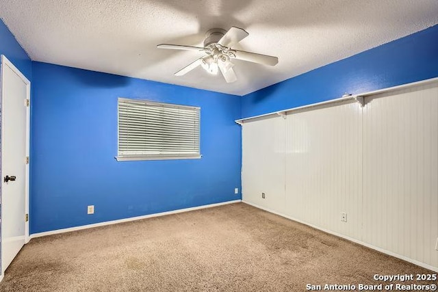 unfurnished bedroom featuring carpet floors, a textured ceiling, and ceiling fan