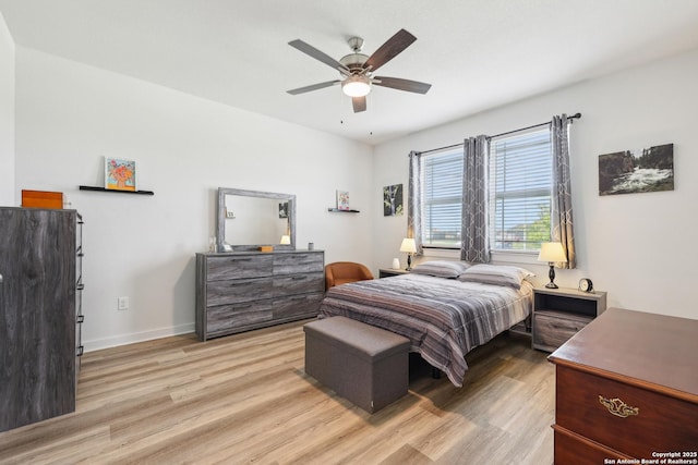 306 Banff, Kyle, TX 78640 - bedroom with light wood finished floors, baseboards, and a ceiling fan