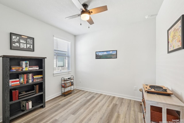 306 Banff, Kyle, TX 78640 - misc room featuring wood finished floors, ceiling fan, and baseboards