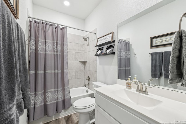 306 Banff, Kyle, TX 78640 - bathroom featuring toilet, wood finished floors, shower / tub combo, and vanity
