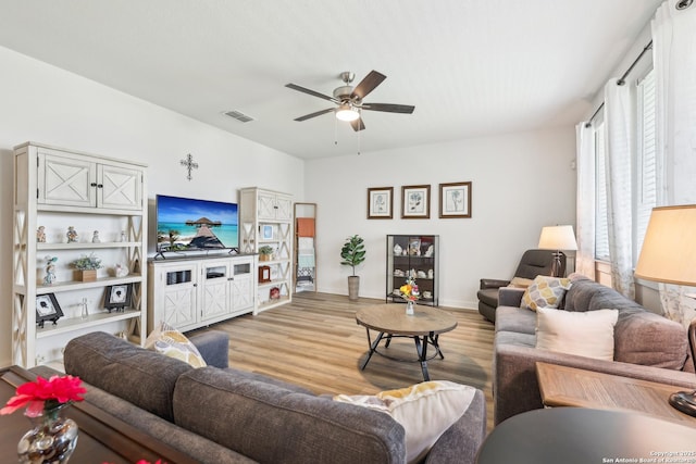 306 Banff, Kyle, TX 78640 - living area featuring light wood-style floors, ceiling fan, and baseboards