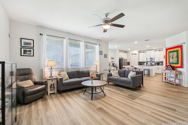 306 Banff, Kyle, TX 78640 - living room with a ceiling fan, light wood-style flooring, and recessed lighting