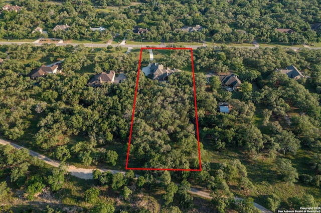 1040 Glenwood, Bulverde, TX 78163 - aerial overview of property's location featuring property boundaries highlighted and a heavily wooded area