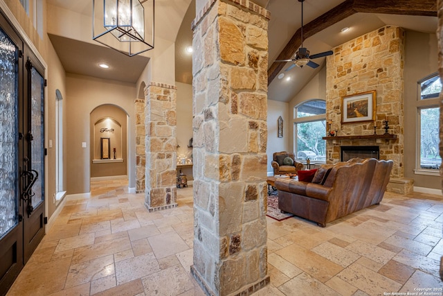 1040 Glenwood, Bulverde, TX 78163 - hallway with arched walkways, stone tile flooring, high vaulted ceiling, baseboards, and ornate columns