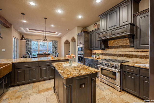 1040 Glenwood, Bulverde, TX 78163 - kitchen with stainless steel appliances, stone tile floors, a textured ceiling, decorative backsplash, and recessed lighting