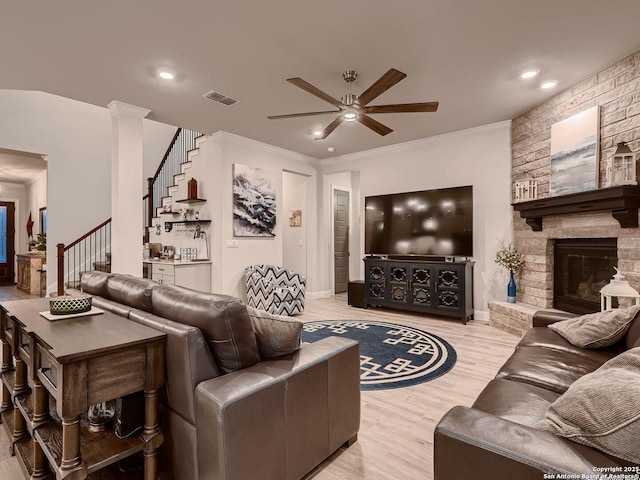 living area with ceiling fan, stairs, light wood-type flooring, recessed lighting, and crown molding