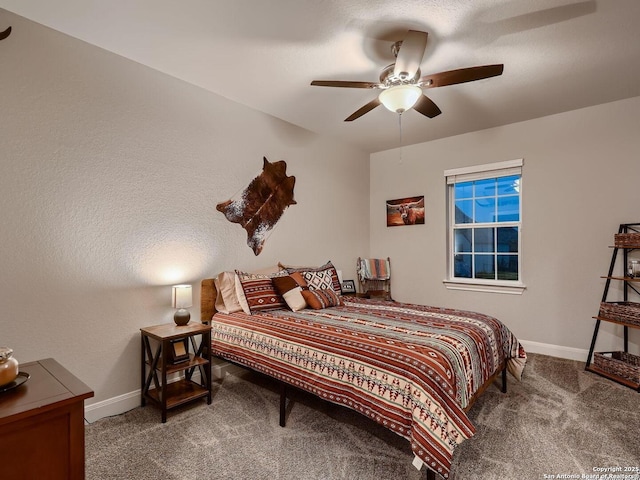 bedroom with carpet, baseboards, and ceiling fan