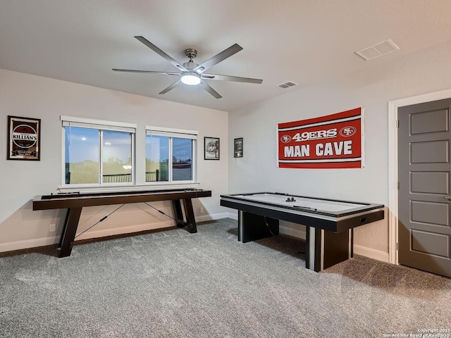 game room featuring baseboards, a ceiling fan, and carpet flooring