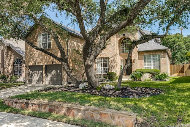 823 Peg Oak, San Antonio, TX 78258 - traditional-style home with an attached garage, brick siding, and driveway
