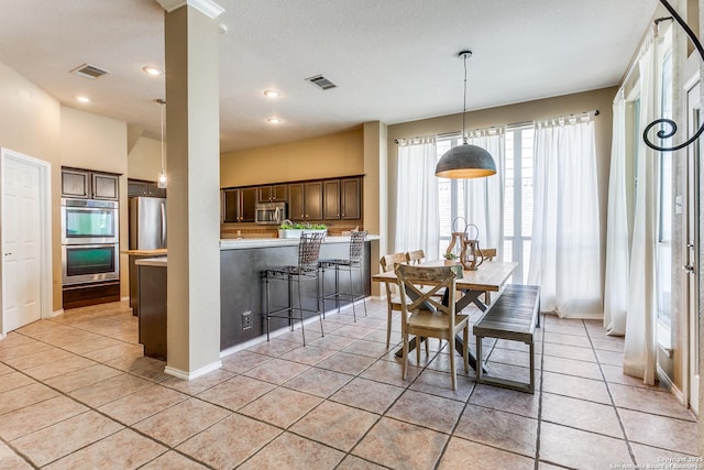 823 Peg Oak, San Antonio, TX 78258 - dining space with light tile patterned flooring and recessed lighting