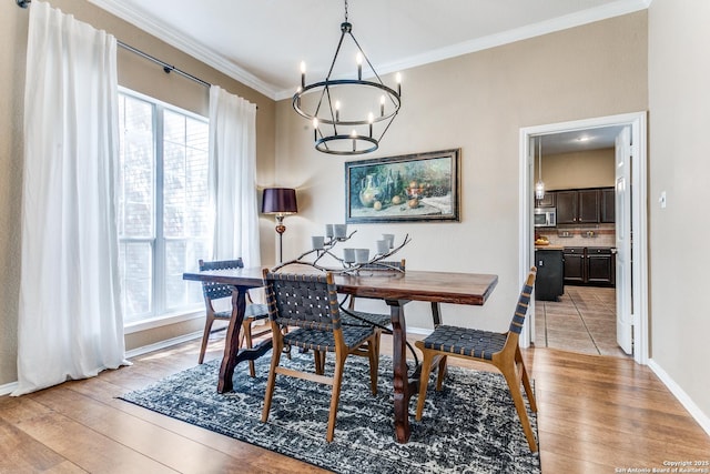 823 Peg Oak, San Antonio, TX 78258 - dining room featuring a chandelier, healthy amount of natural light, crown molding, and light wood-type flooring