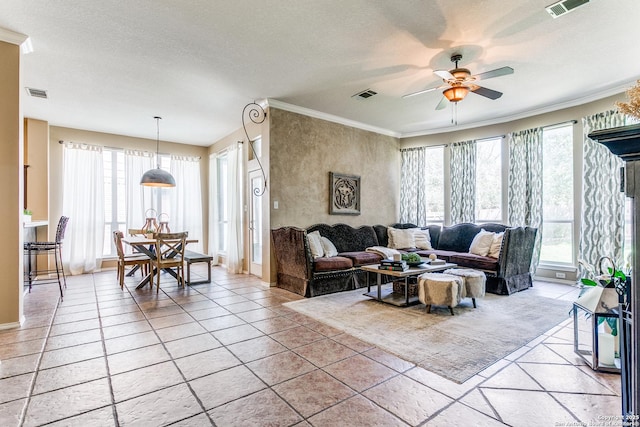 823 Peg Oak, San Antonio, TX 78258 - living area with ornamental molding, a ceiling fan, a textured ceiling, and light tile patterned floors