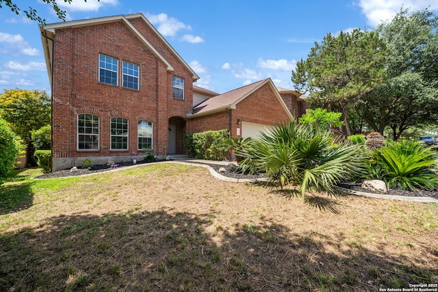 38 Atwell, San Antonio, TX 78254 - view of front of property with brick siding, an attached garage, and a front yard
