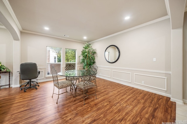 38 Atwell, San Antonio, TX 78254 - dining space with wood finished floors, crown molding, arched walkways, recessed lighting, and wainscoting