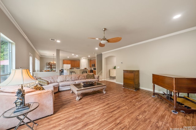 38 Atwell, San Antonio, TX 78254 - living area featuring crown molding, a ceiling fan, light wood-type flooring, arched walkways, and recessed lighting