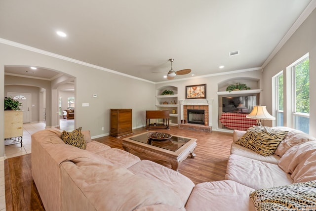 38 Atwell, San Antonio, TX 78254 - living area with built in features, a ceiling fan, arched walkways, recessed lighting, and a fireplace
