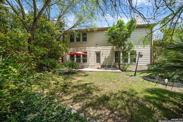 38 Atwell, San Antonio, TX 78254 - rear view of property with a patio area, a chimney, and a yard