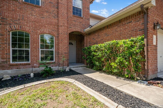38 Atwell, San Antonio, TX 78254 - entrance to property with brick siding and an attached garage