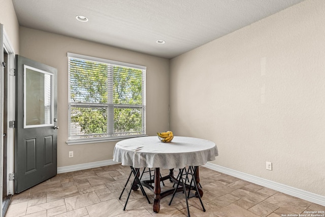 1002 Faith Rnch, San Antonio, TX 78245 - dining room with baseboards, light stone finish flooring, and recessed lighting
