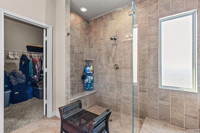 1002 Faith Rnch, San Antonio, TX 78245 - bathroom with a shower stall, a spacious closet, and recessed lighting