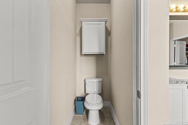 1002 Faith Rnch, San Antonio, TX 78245 - bathroom featuring toilet, baseboards, and tile patterned floors