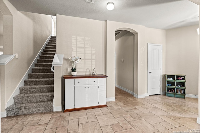 1002 Faith Rnch, San Antonio, TX 78245 - stairway with arched walkways and baseboards