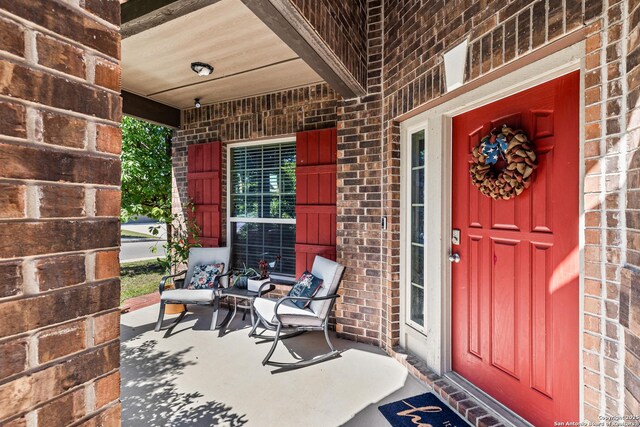 1002 Faith Rnch, San Antonio, TX 78245 - entrance to property featuring a porch and brick siding
