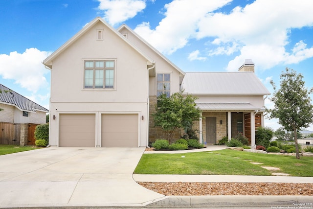 view of front of house featuring an attached garage, driveway, a chimney, and stone siding