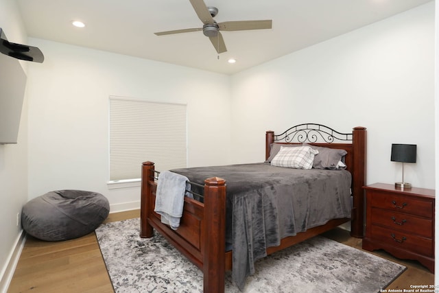 bedroom with wood finished floors, baseboards, recessed lighting, and a ceiling fan