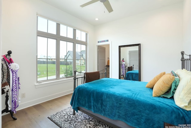bedroom featuring wood finished floors, baseboards, ceiling fan, and recessed lighting
