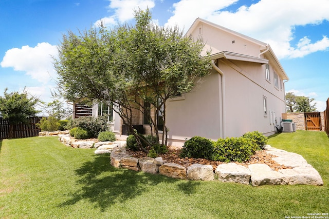 view of property exterior featuring cooling unit and stucco siding