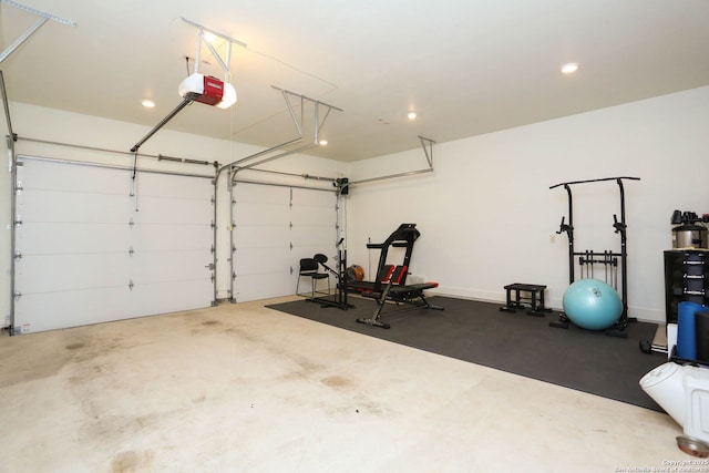 garage with a garage door opener and recessed lighting
