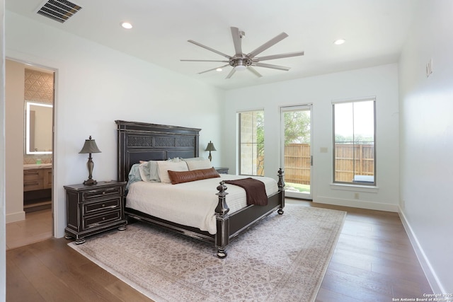 bedroom with wood finished floors, baseboards, connected bathroom, recessed lighting, and ceiling fan