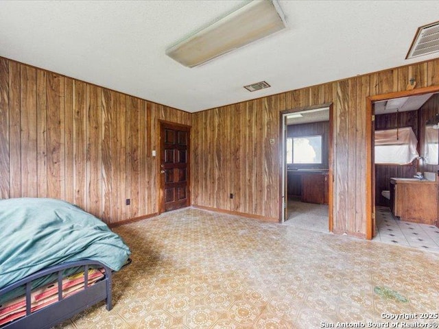 1010 Country Oak Dr, Luling, TX 78648 - unfurnished bedroom with wooden walls