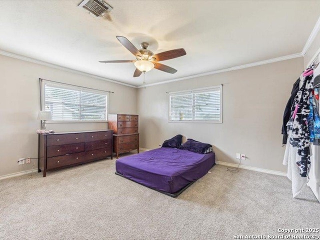 1010 Country Oak Dr, Luling, TX 78648 - carpeted bedroom featuring ornamental molding, multiple windows, baseboards, and ceiling fan