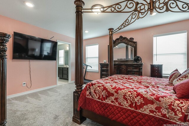 6136 Sunflower, San Antonio, TX 78244 - carpeted bedroom featuring baseboards and connected bathroom