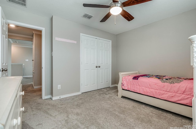 6136 Sunflower, San Antonio, TX 78244 - bedroom with light colored carpet, a closet, baseboards, and a ceiling fan