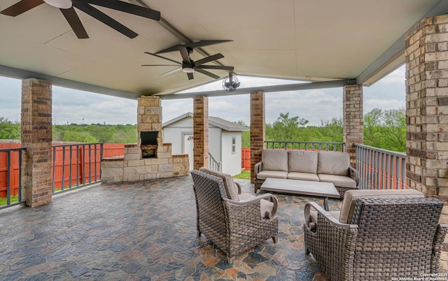 6136 Sunflower, San Antonio, TX 78244 - view of patio / terrace with an outdoor living space with a fireplace and a ceiling fan