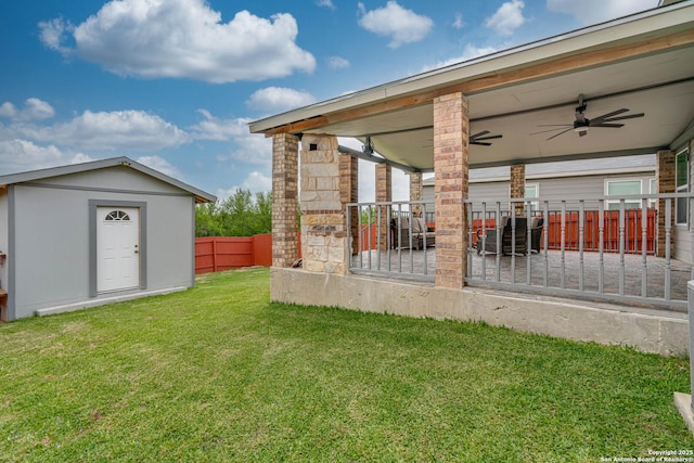 6136 Sunflower, San Antonio, TX 78244 - view of yard featuring a ceiling fan, an outdoor structure, and a storage shed