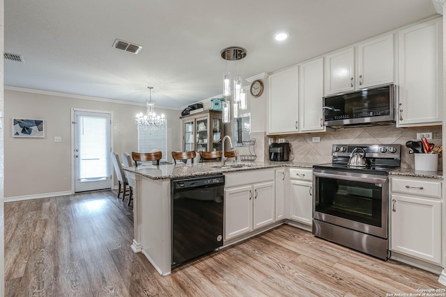 6136 Sunflower, San Antonio, TX 78244 - kitchen featuring appliances with stainless steel finishes, crown molding, a sink, white cabinetry, and backsplash