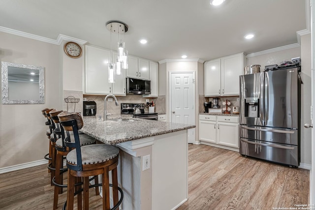 6136 Sunflower, San Antonio, TX 78244 - kitchen with appliances with stainless steel finishes, a peninsula, light wood-type flooring, white cabinetry, and crown molding