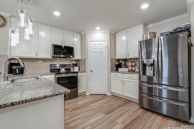6136 Sunflower, San Antonio, TX 78244 - kitchen with appliances with stainless steel finishes, a sink, white cabinetry, ornamental molding, and recessed lighting