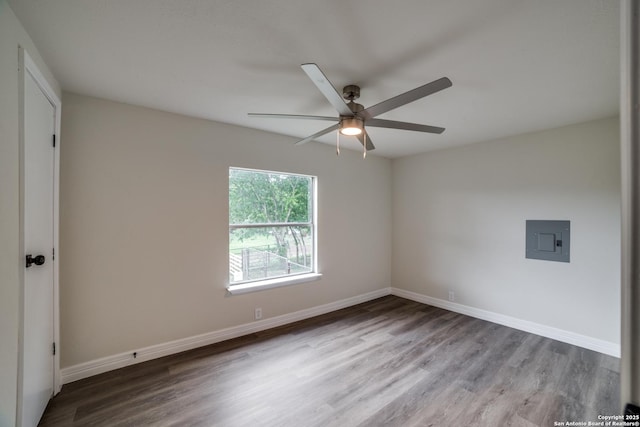 13635 Owl Tree, San Antonio, TX 78253 - unfurnished room with electric panel, a ceiling fan, wood finished floors, and baseboards