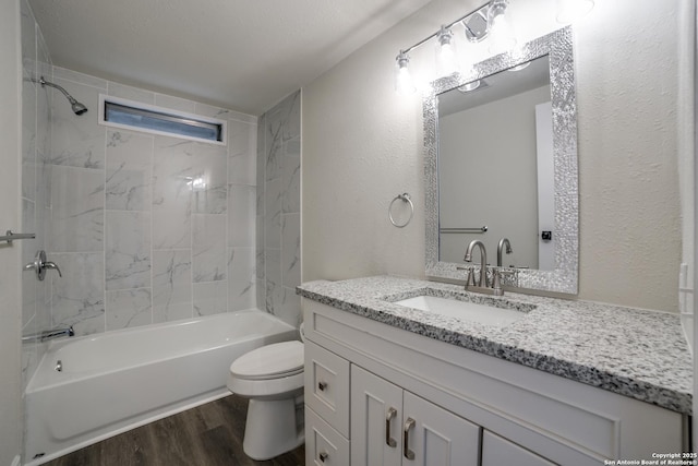 13635 Owl Tree, San Antonio, TX 78253 - full bathroom with wood finished floors, toilet, shower / bath combination, vanity, and a textured wall