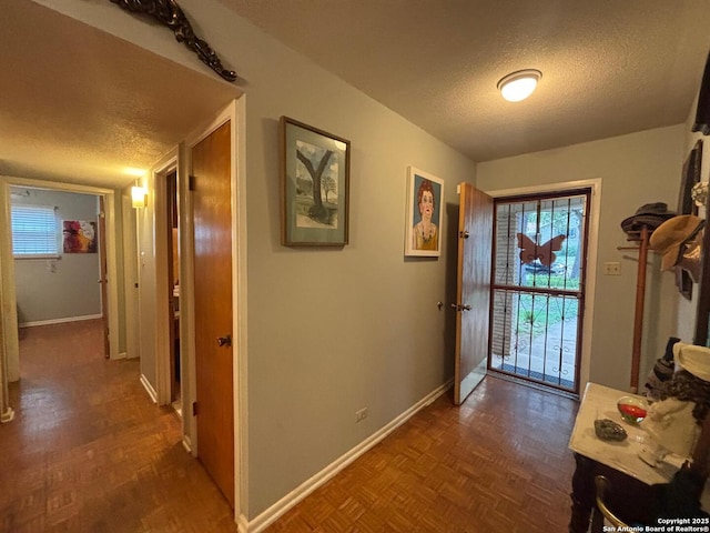 3802 Quiver, San Antonio, TX 78238 - doorway to outside with a textured ceiling, baseboards, and healthy amount of natural light