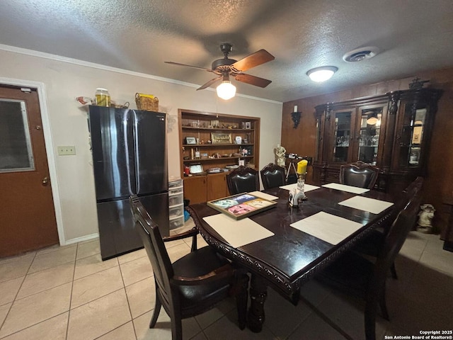 3802 Quiver, San Antonio, TX 78238 - dining room with a textured ceiling, ceiling fan, light tile patterned flooring, ornamental molding, and baseboards