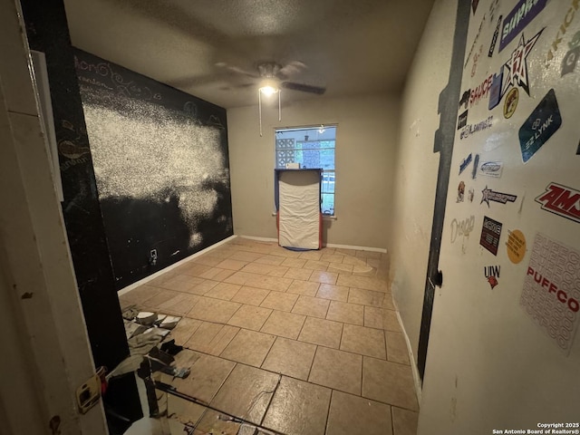5039 Bayhead, San Antonio, TX 78220 - tiled empty room featuring ceiling fan, baseboards, and a textured ceiling